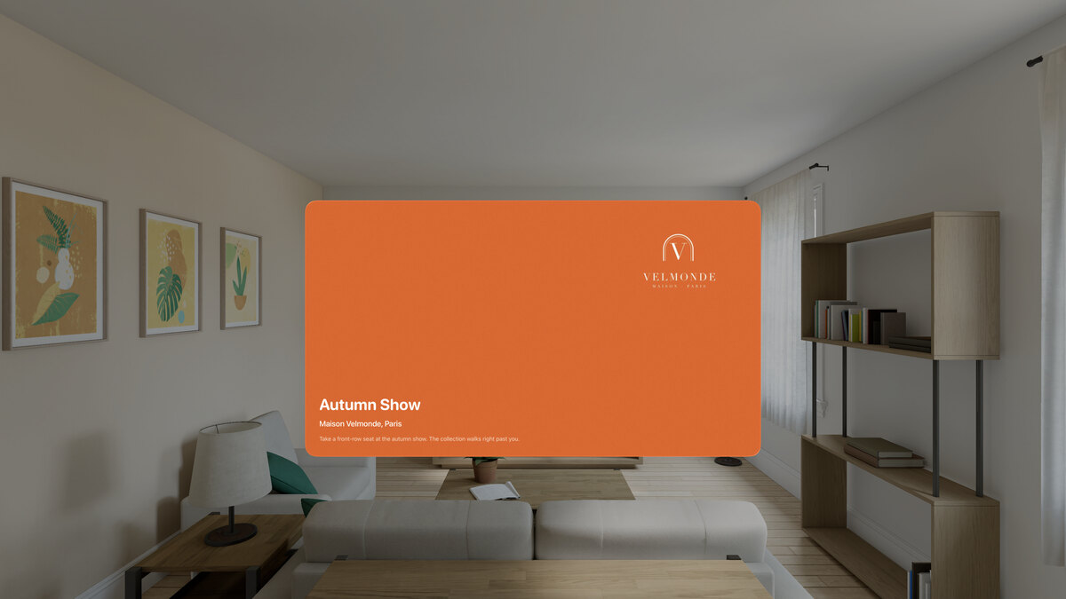 The Autumn Show page on Apple&nbsp;Vision&nbsp;Pro, in a room: the orange cover with the Maison Velmonde logo, and a Play button.